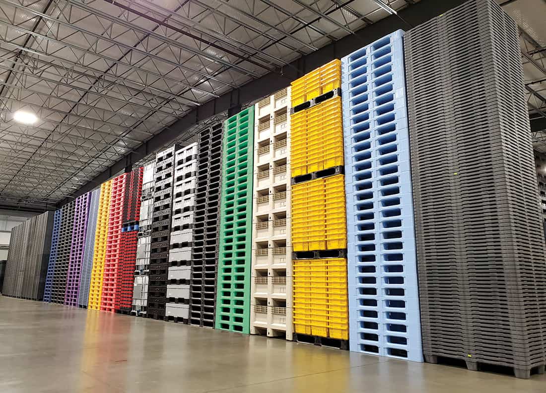 stacked plastic pallets and bins